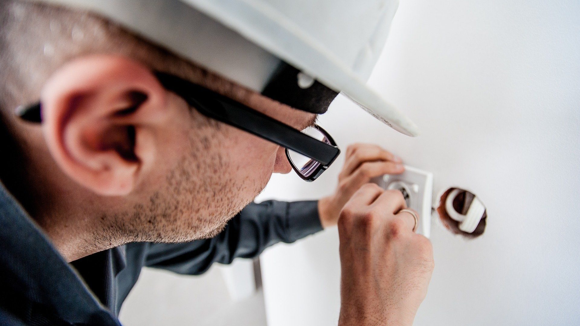 Electrician fixing an outlet